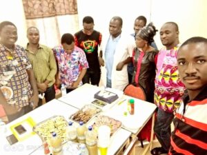 Site Coordinator in Burkina Faso celebrating the end of the course with several participants.